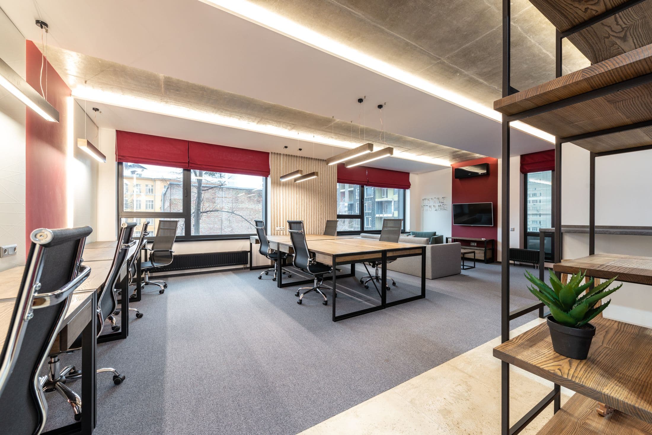 Open office with workstations and large windows
