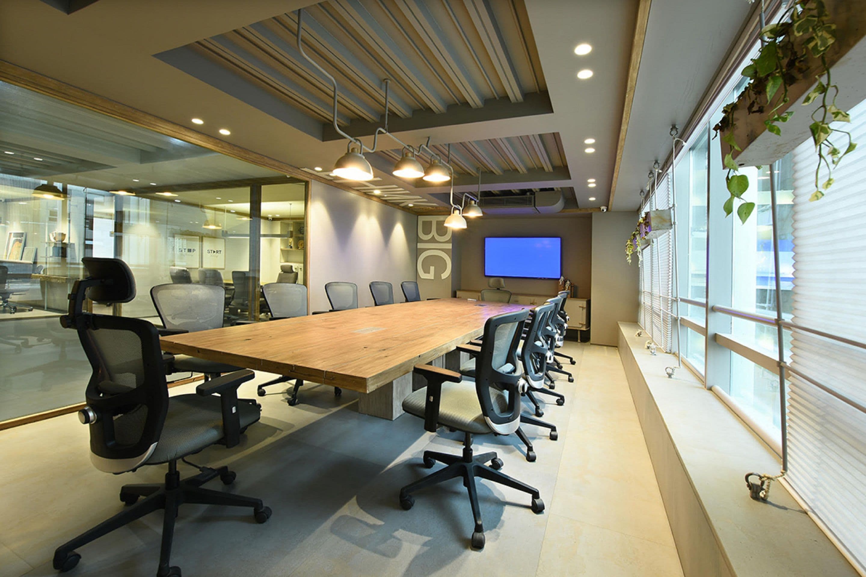 Modern boardroom furnished with a conference table and task chairs
