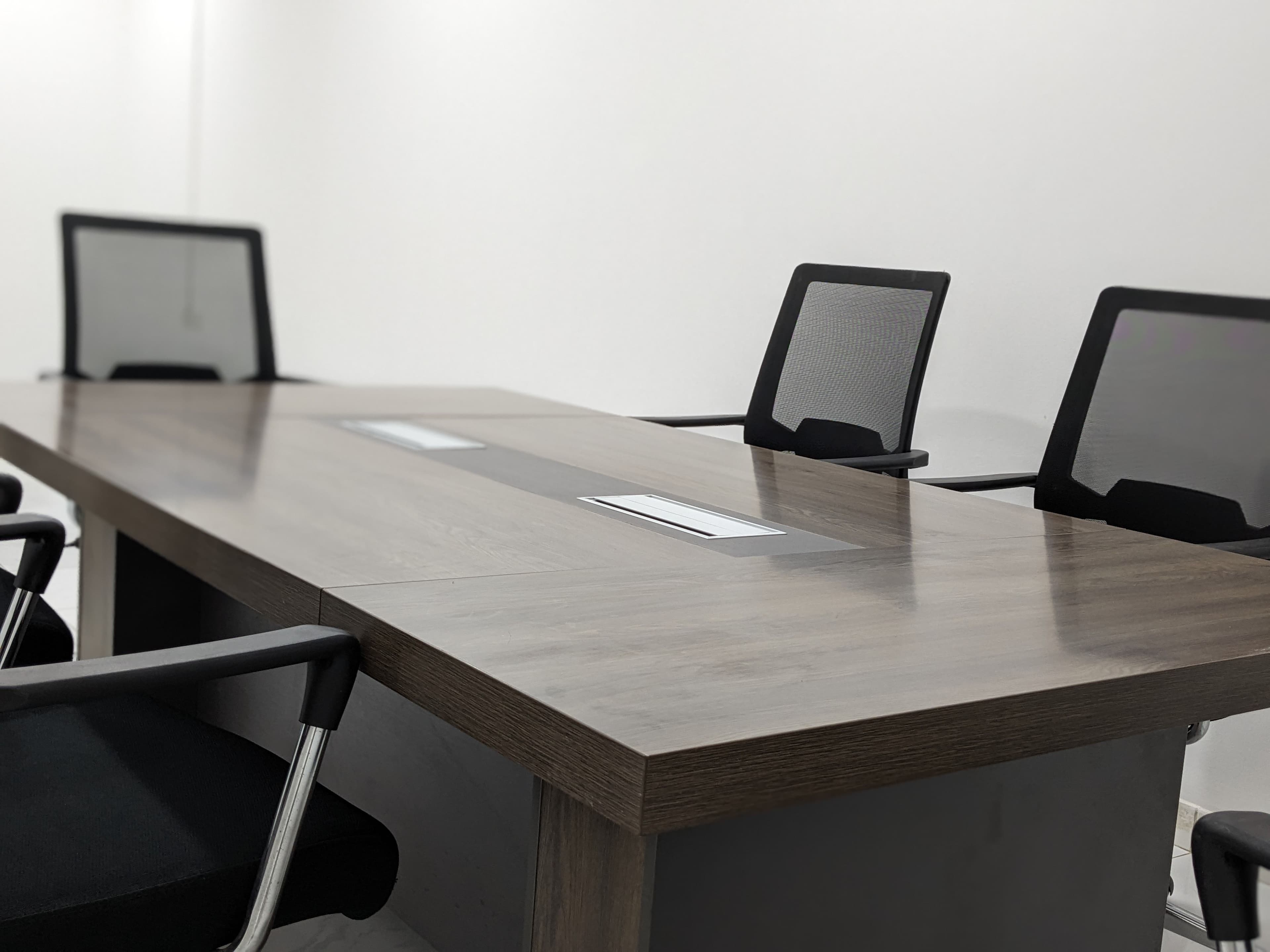 Conference table and task chairs in an office